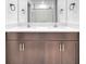 Bathroom features a double vanity with white countertops and dark cabinets at 22223 Storybook Cabin Way, Land O Lakes, FL 34637