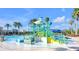 Fun-filled water park with slides and interactive water features, perfect for Gathering entertainment on a beautiful day at 22223 Storybook Cabin Way, Land O Lakes, FL 34637
