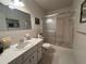 Clean bathroom featuring a vanity with sink and a glass-enclosed shower at 2255 Philippine Dr # 21, Clearwater, FL 33763