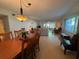 Open dining and living area featuring hardwood floors and an abundance of natural light at 2255 Philippine Dr # 21, Clearwater, FL 33763