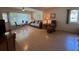 Inviting living room with comfortable furnishings, a ceiling fan, and a view of the outdoors at 2255 Philippine Dr # 21, Clearwater, FL 33763