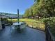 Relaxing patio space with seating and views of the well-maintained lawn and mature trees at 2255 Philippine Dr # 21, Clearwater, FL 33763