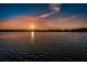 Sunset view of waterfront with tranquil waters shimmering under a sky with clouds at 2255 Philippine Dr # 21, Clearwater, FL 33763