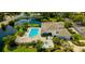 Stunning aerial shot featuring a pool, hot tub, and community amenities, offering a luxurious outdoor experience at 2323 Feather Sound Dr # F101, Clearwater, FL 33762