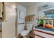 Functional bathroom features a walk-in shower, updated fixtures, and tiled floors at 2323 Feather Sound Dr # F101, Clearwater, FL 33762
