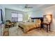 Relaxing bedroom boasts neutral tones, side tables, and comfortable furniture arrangement at 2323 Feather Sound Dr # F101, Clearwater, FL 33762