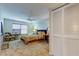 Comfortable bedroom features soft lighting, a ceiling fan, and ample closet space at 2323 Feather Sound Dr # F101, Clearwater, FL 33762