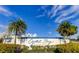 Crystal Bay at Feather Sound signage surrounded by lush tropical landscaping under a blue sky at 2323 Feather Sound Dr # F101, Clearwater, FL 33762