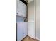Efficient laundry area with stacked washer and dryer and closet at 2323 Feather Sound Dr # F101, Clearwater, FL 33762