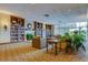 Charming library with fireplace, comfortable seating, and extensive bookshelves at 2323 Feather Sound Dr # F101, Clearwater, FL 33762