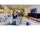Cozy living room view showcases modern lighting and open floor plan into the dining area at 2323 Feather Sound Dr # F101, Clearwater, FL 33762