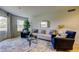 Comfortable living room with bright interior design elements, sleek furniture and natural light at 2323 Feather Sound Dr # F101, Clearwater, FL 33762