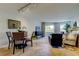Open floor plan features a dining room and living room with lots of natural light and cozy seating at 2323 Feather Sound Dr # F101, Clearwater, FL 33762