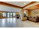 Well-lit lobby with tiled floors, seating, and view to the outside at 2323 Feather Sound Dr # F101, Clearwater, FL 33762