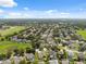 An aerial view showcases a sprawling residential neighborhood with lush greenery and neatly arranged homes at 2816 Pankaw Ln, Valrico, FL 33596