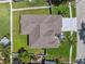 An aerial close-up view of the roof and yard of a single Gathering home with a green lawn at 2816 Pankaw Ln, Valrico, FL 33596