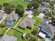 An aerial view of a single Gathering home with a manicured lawn and fenced yard in a residential neighborhood at 2816 Pankaw Ln, Valrico, FL 33596