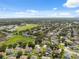 Wide aerial view of a neighborhood in a suburban area near a park and schools at 2816 Pankaw Ln, Valrico, FL 33596