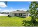 Expansive backyard with lush green grass and a covered patio, perfect for outdoor entertaining and relaxation at 2816 Pankaw Ln, Valrico, FL 33596