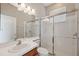 Modern bathroom featuring a glass shower door, sink, vanity, and contemporary lighting at 2816 Pankaw Ln, Valrico, FL 33596