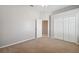 Bedroom with neutral carpet, double closet, and a fan to circulate air at 2816 Pankaw Ln, Valrico, FL 33596