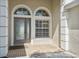 Welcoming entryway with decorative windows and a glass-paneled front door at 2816 Pankaw Ln, Valrico, FL 33596