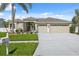 Attractive single-story home with a neatly kept yard, a mailbox, and an attached three-car garage at 2816 Pankaw Ln, Valrico, FL 33596