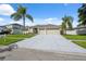 Well maintained home featuring mature landscaping, ample parking, and a three-car garage at 2816 Pankaw Ln, Valrico, FL 33596
