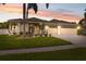 Charming single-story home with a well-manicured lawn, mature trees, and a three-car garage at 2816 Pankaw Ln, Valrico, FL 33596