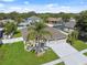 Beautiful home with mature landscaping, a well-kept lawn, and a spacious driveway leading to a three-car garage at 2816 Pankaw Ln, Valrico, FL 33596