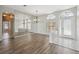 Open floorplan living area with hardwood floors, decorative mirrors, lots of natural light at 2816 Pankaw Ln, Valrico, FL 33596