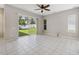 Bright living room with tile flooring and sliding glass doors to the backyard at 2816 Pankaw Ln, Valrico, FL 33596