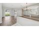 Bright living room featuring wood floors and a large sliding glass door at 2816 Pankaw Ln, Valrico, FL 33596