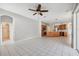 Open floor plan connecting living room and kitchen features tile flooring and natural light at 2816 Pankaw Ln, Valrico, FL 33596