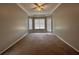 Large main bedroom offering tray ceiling, ceiling fan, carpet flooring, and plenty of natural light at 2816 Pankaw Ln, Valrico, FL 33596