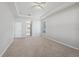 Large main bedroom featuring carpeted flooring, a ceiling fan, and access to the ensuite bath at 2816 Pankaw Ln, Valrico, FL 33596