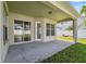 Covered patio with a view of the yard, sliding doors, and natural light at 2816 Pankaw Ln, Valrico, FL 33596