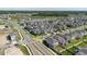 Community overview with pond and highway access providing scenic view from a higher vantage point at 3047 Adams Cross Dr, Zephyrhills, FL 33540