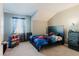 Bright bedroom with vaulted ceiling, carpeted floor, and ample natural light at 3047 Adams Cross Dr, Zephyrhills, FL 33540