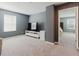 Relaxing bonus room featuring a large TV and access to another room at 3047 Adams Cross Dr, Zephyrhills, FL 33540