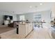 Open concept kitchen with granite countertops and a dining area at 3047 Adams Cross Dr, Zephyrhills, FL 33540