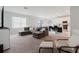 Cozy living room with comfortable seating and a view of the kitchen at 3047 Adams Cross Dr, Zephyrhills, FL 33540
