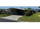 Exterior view of a single story home with covered parking and mature landscaping at 3111 Great Oak St, Wesley Chapel, FL 33543