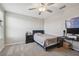 Bedroom with a fan and a light, featuring light colored carpet and neutral walls at 31440 Barrel Wave Way, Wesley Chapel, FL 33545