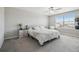 Bright primary bedroom with carpeted floors and a large window at 31440 Barrel Wave Way, Wesley Chapel, FL 33545