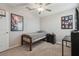 Bedroom with a ceiling fan, carpeted flooring, and a comfortable single bed at 31440 Barrel Wave Way, Wesley Chapel, FL 33545