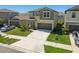 Charming two-story home with a spacious driveway and well-manicured lawn at 31440 Barrel Wave Way, Wesley Chapel, FL 33545