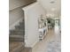 Bright foyer featuring tile floors, staircase, and an open view to the dining area at 31440 Barrel Wave Way, Wesley Chapel, FL 33545
