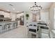 Spacious kitchen and dining area with a central island and ample seating at 31440 Barrel Wave Way, Wesley Chapel, FL 33545