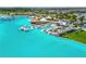Beautiful Epperson Lagoon view with turquoise water, swim up bar, and lounging areas at 31440 Barrel Wave Way, Wesley Chapel, FL 33545
